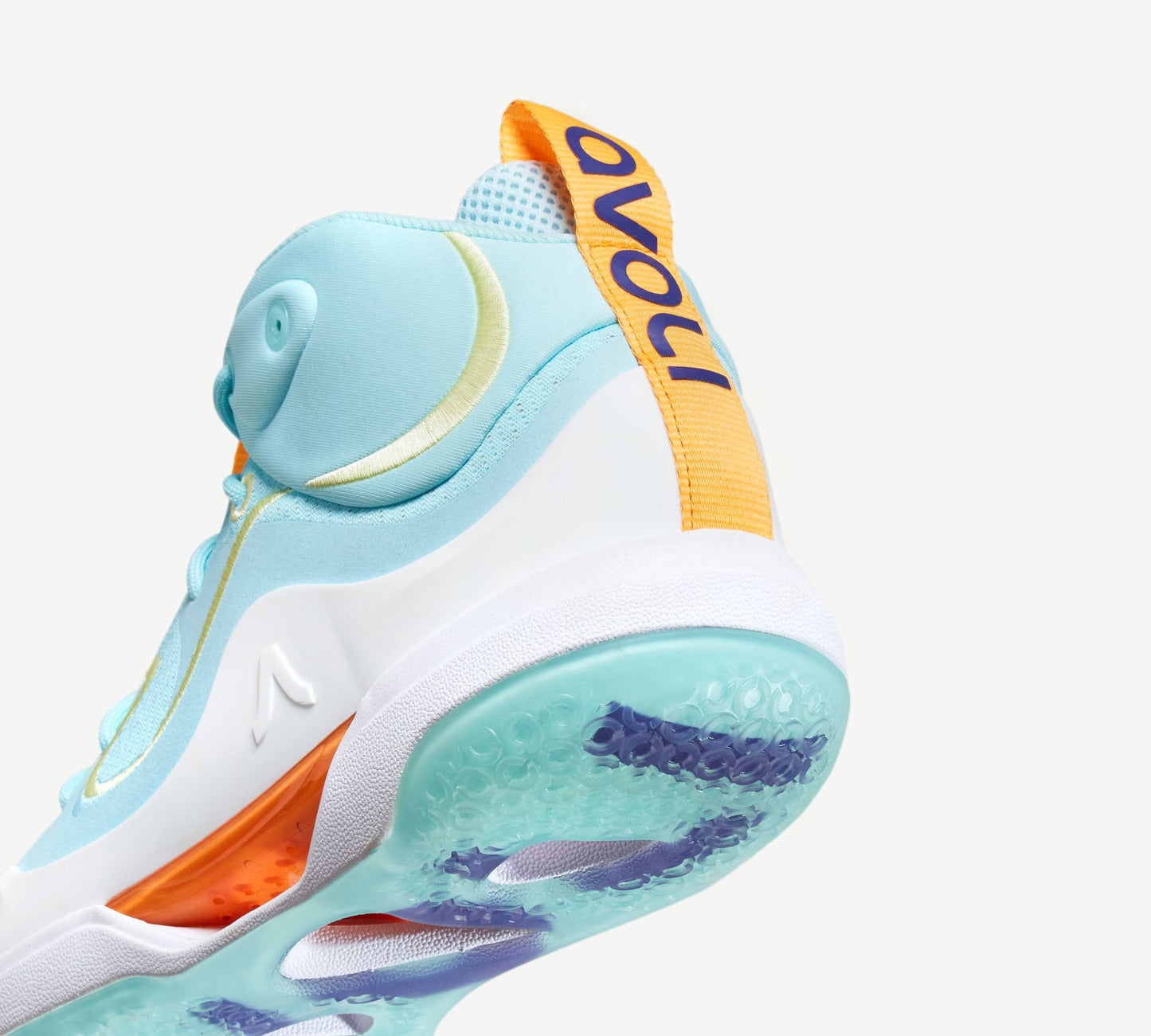 A light blue and orange mid-top volleyball shoe with a white midsole