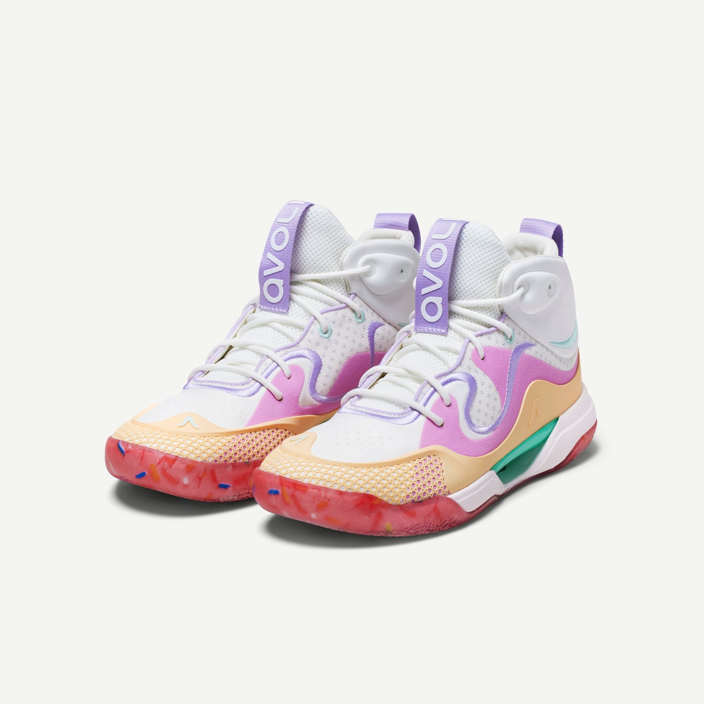 Colorful mid top sneaker with a white, pink, yellow, and red design on a white background