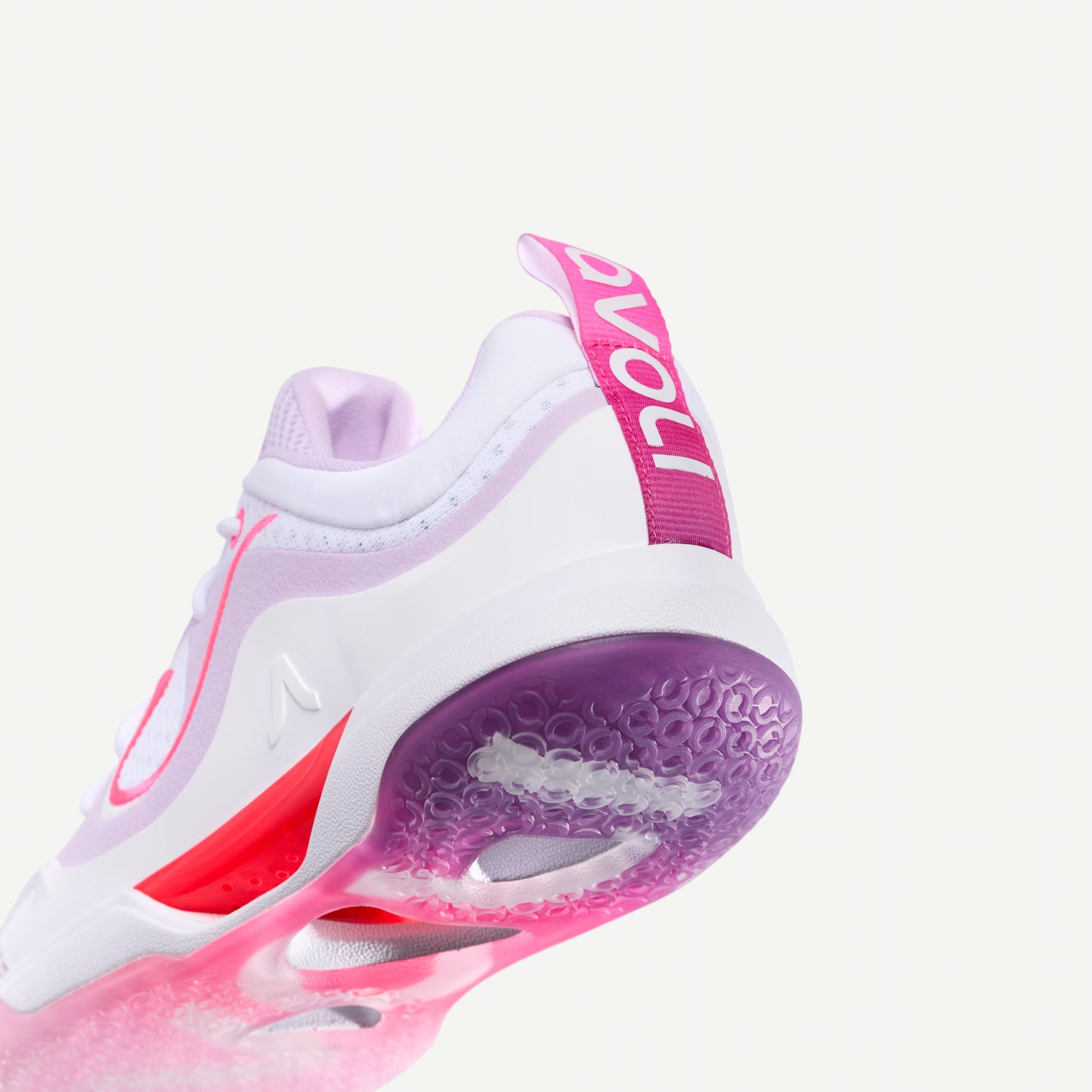 White and pink low top volleyball sneaker with red, pink and purple accents on a white background