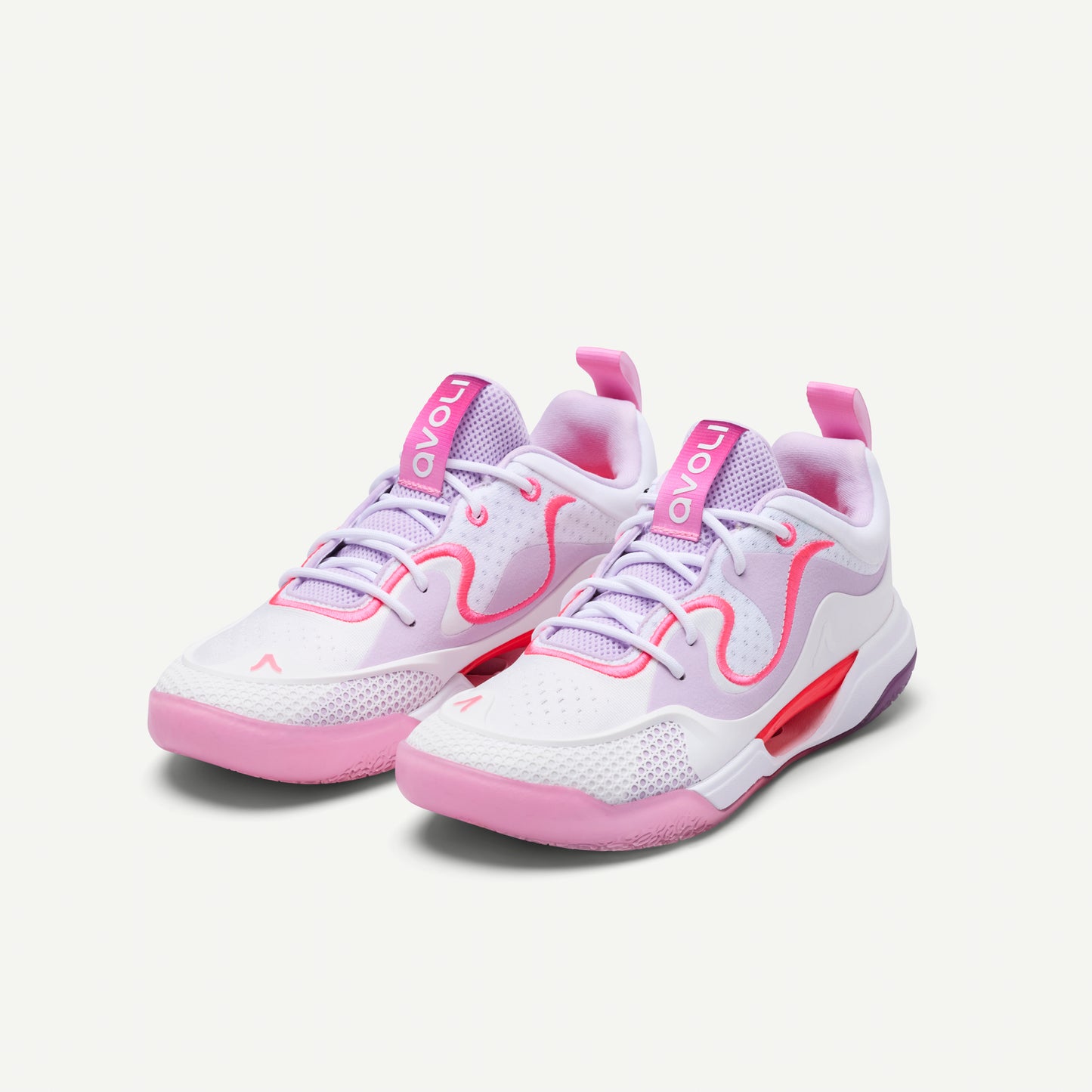 White and pink low top volleyball sneaker with red, pink and purple accents on a white background