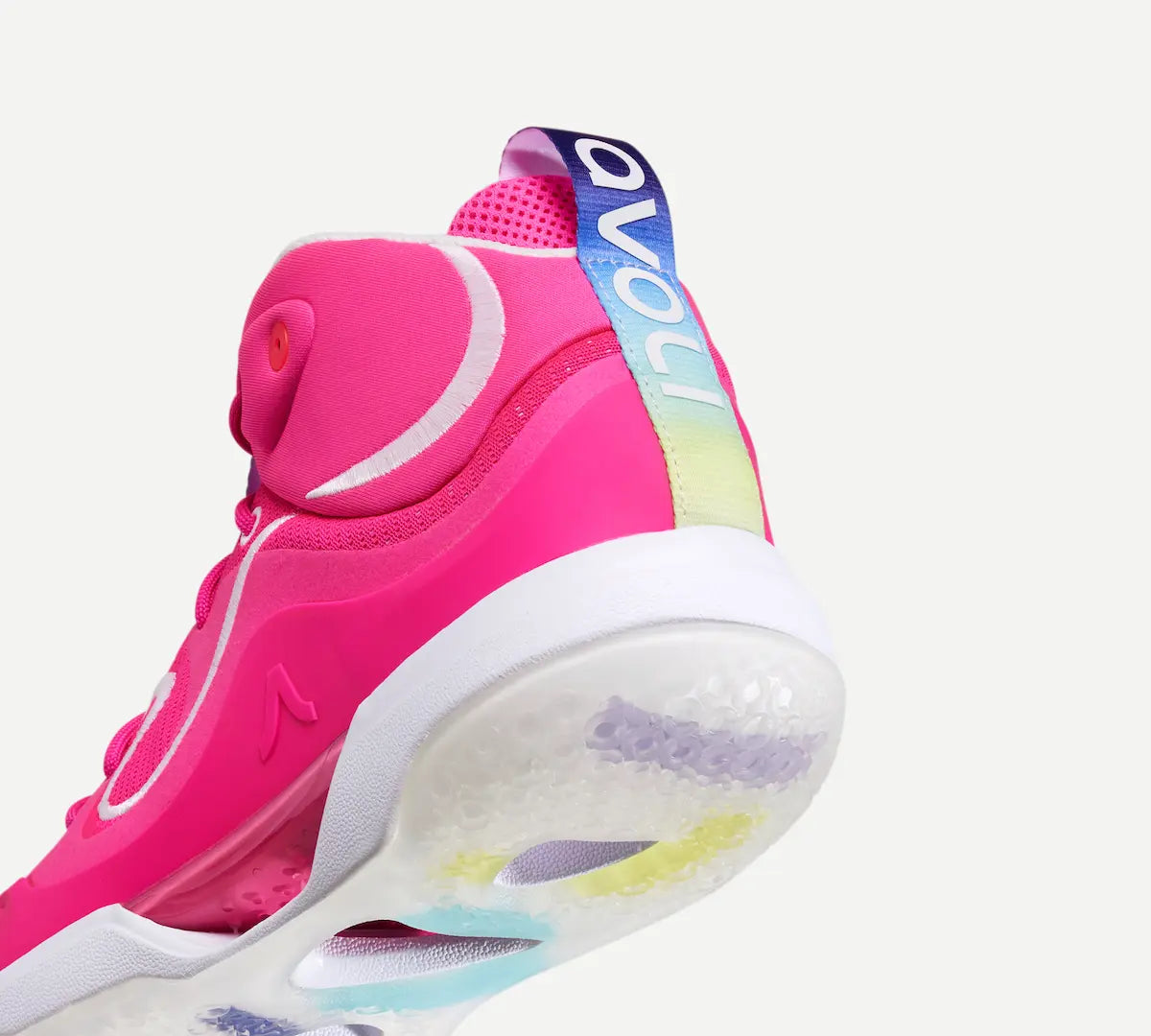 Heel view of a pink mid-top volleyball shoe with white accents and a unique design, likely made for fast movements and high-impact plays.