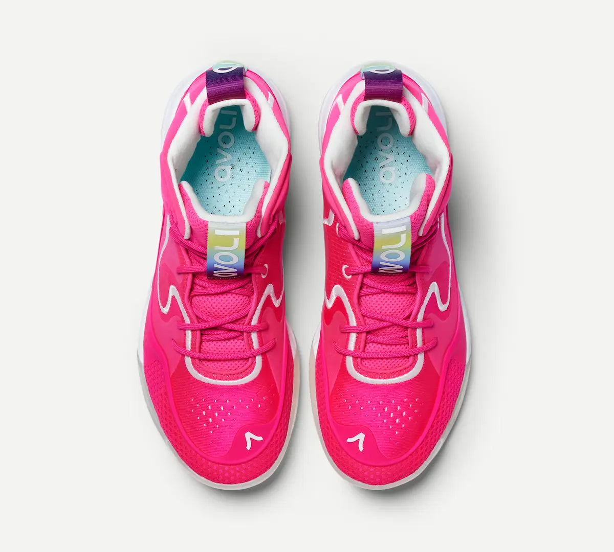 A pair of pink mid-top volleyball shoes with white accents and a unique design, likely made for fast movements and high-impact plays.