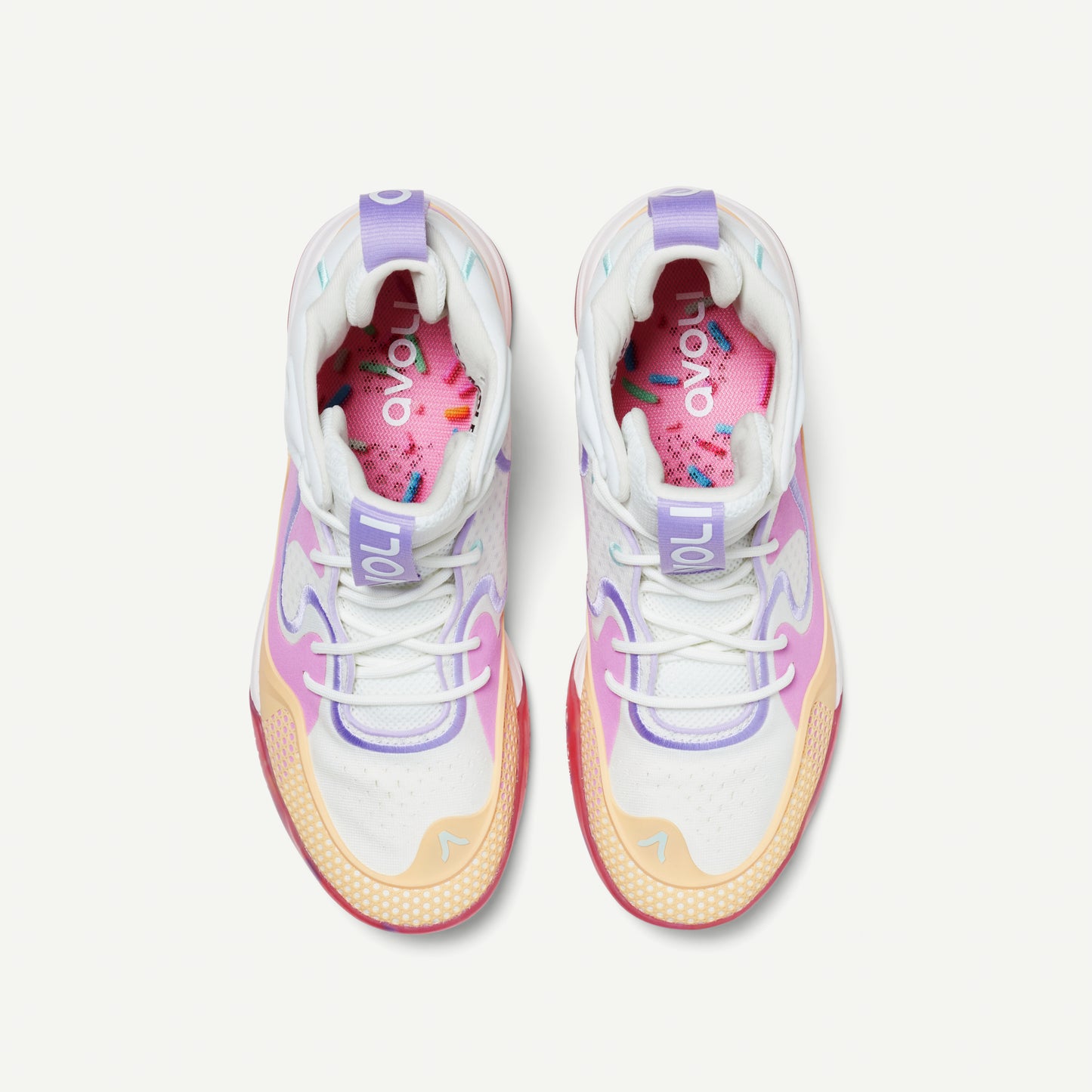 Colorful mid top sneakers with a white, pink, yellow, and red design on a white background