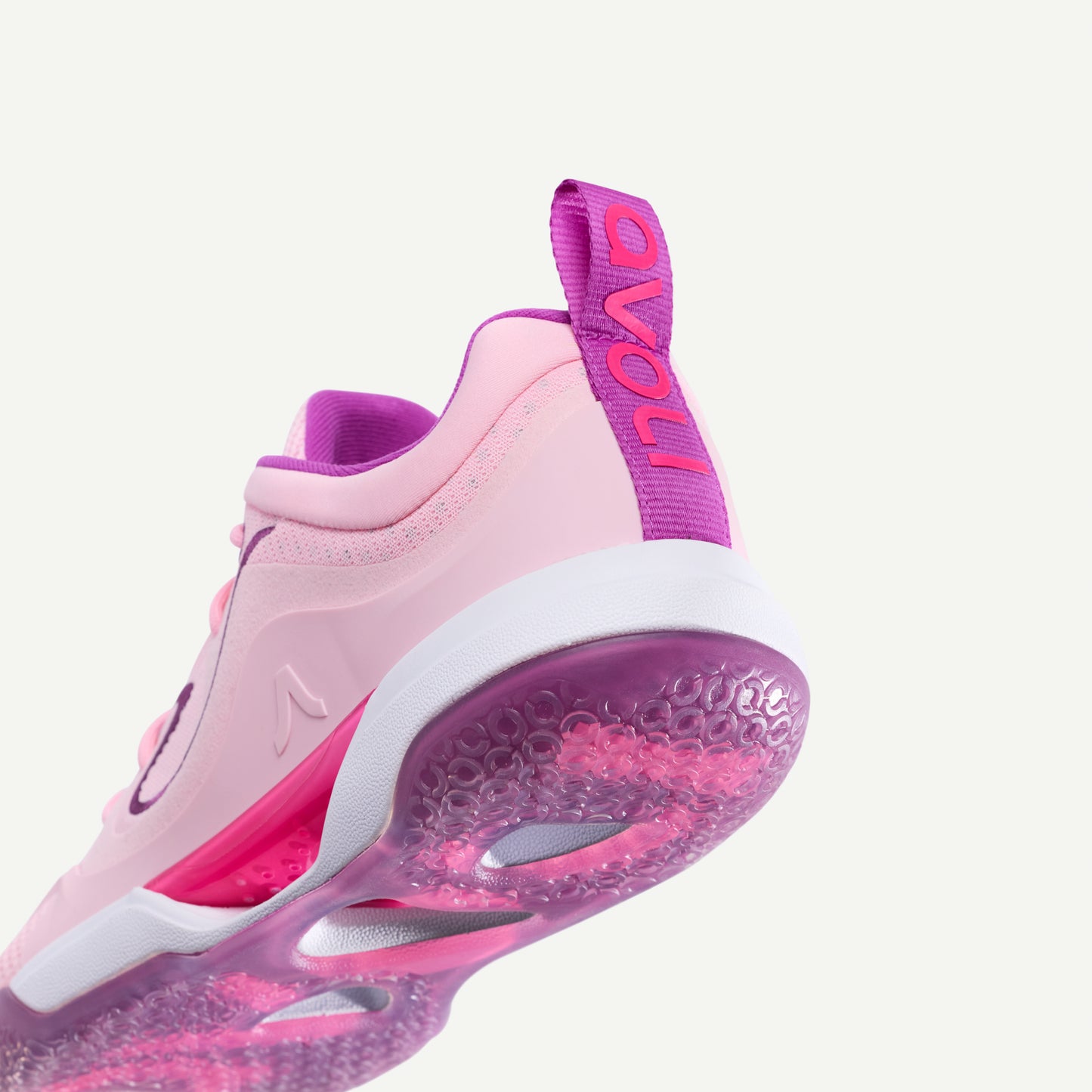 Pink and purple low top volleyball sneaker on a white background
