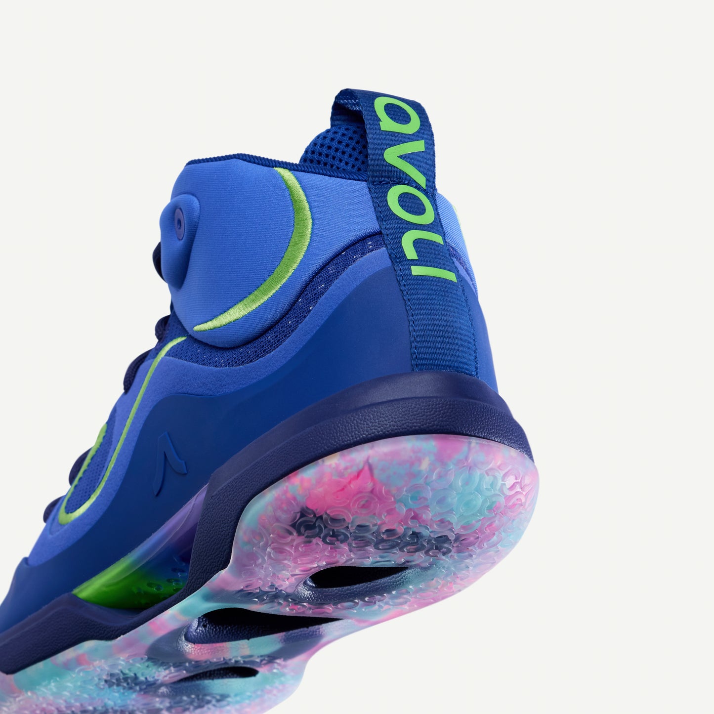 Blue volleyball shoe with colorful sole on a white background