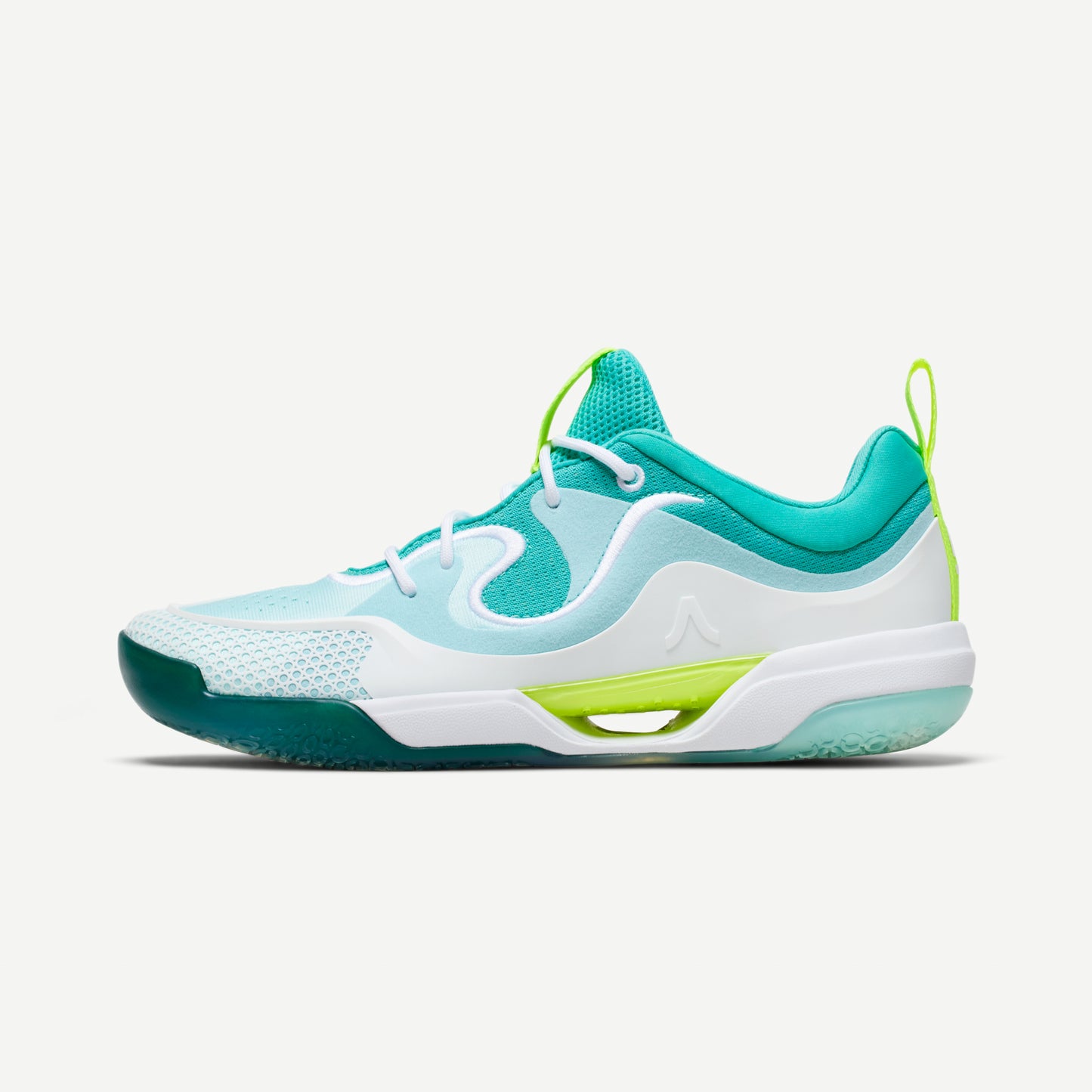 A  white and green low-top volleyball shoe with reinforced toe protection and superior traction designed for court play.