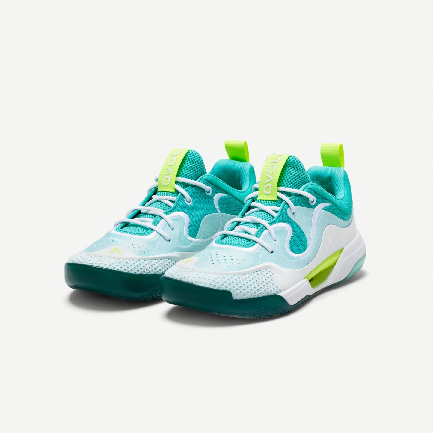 Outsole of a white and green low-top volleyball shoes with reinforced toe protection and superior traction designed for court play.