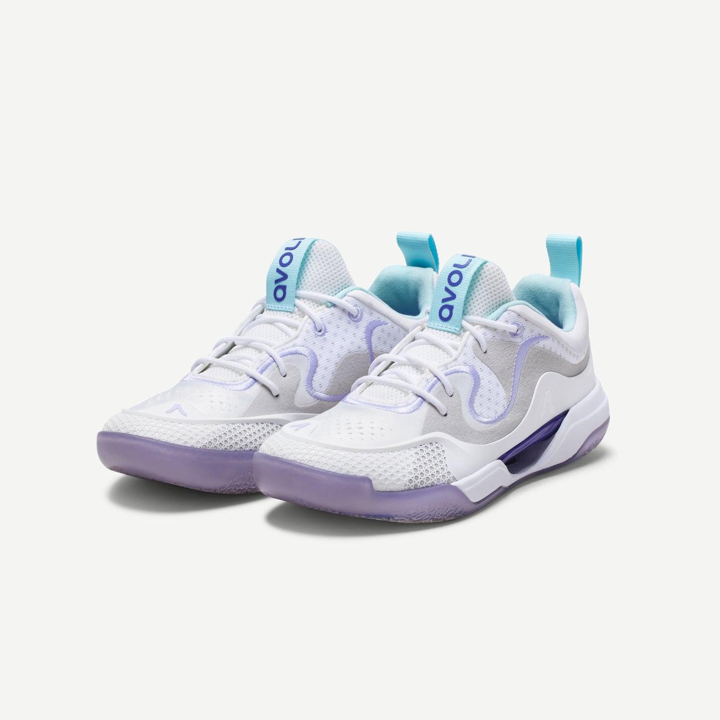 A pair of a white low top volleyball shoes with purple accents and a heather pattern