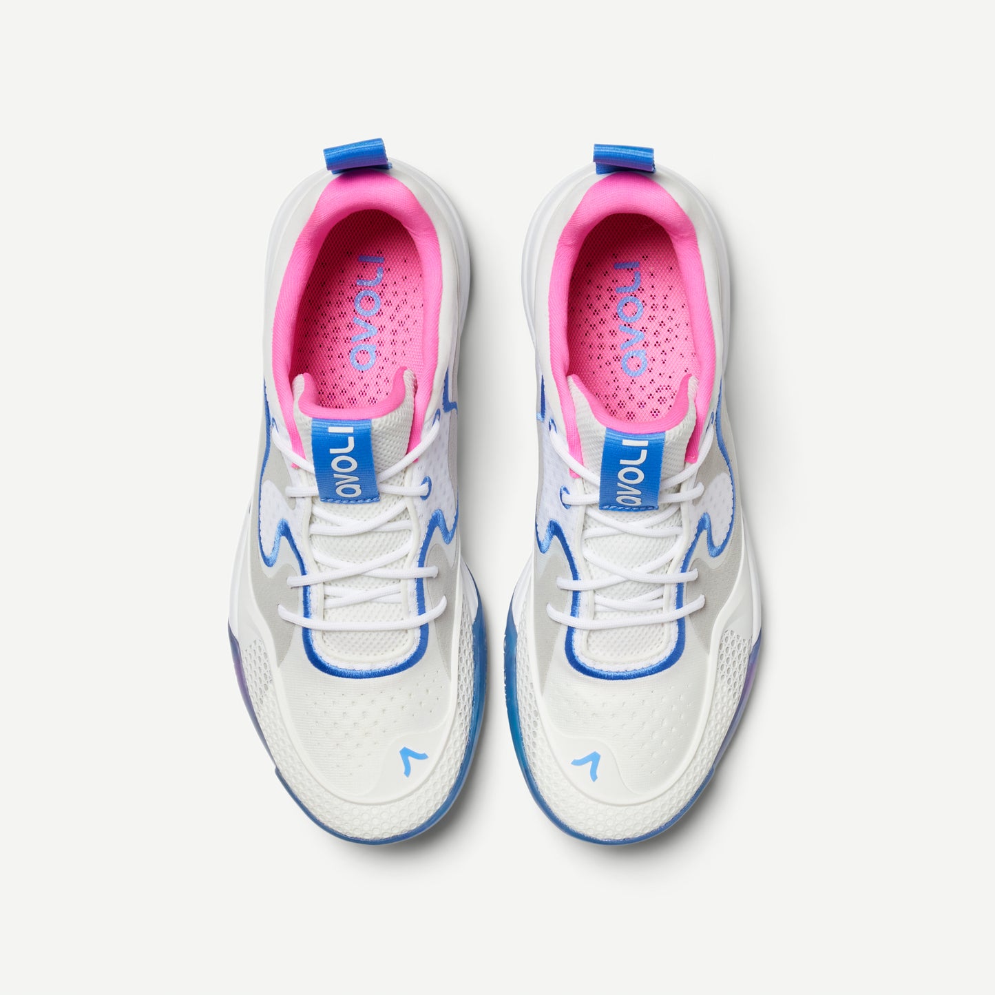 A white volleyball low top shoe with blue and pink accents, featuring a distinctive design on the sole and a label with the brand name 'Avoli' on the heel.
