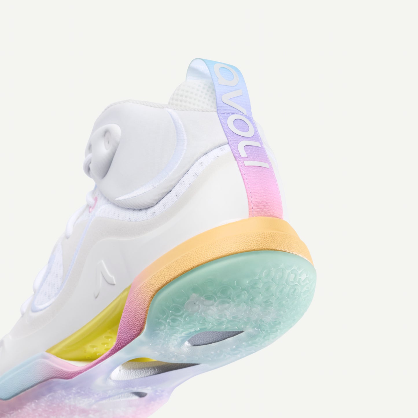 White avoli volleyball sneaker with colorful sole on a white background