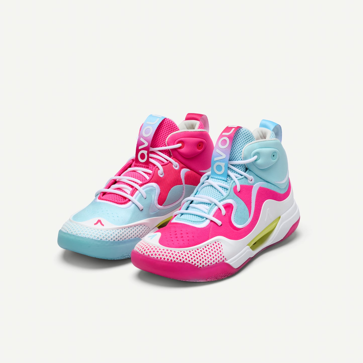Mismatched pair of pink and light blue mid top volleyball sneakers on a white background