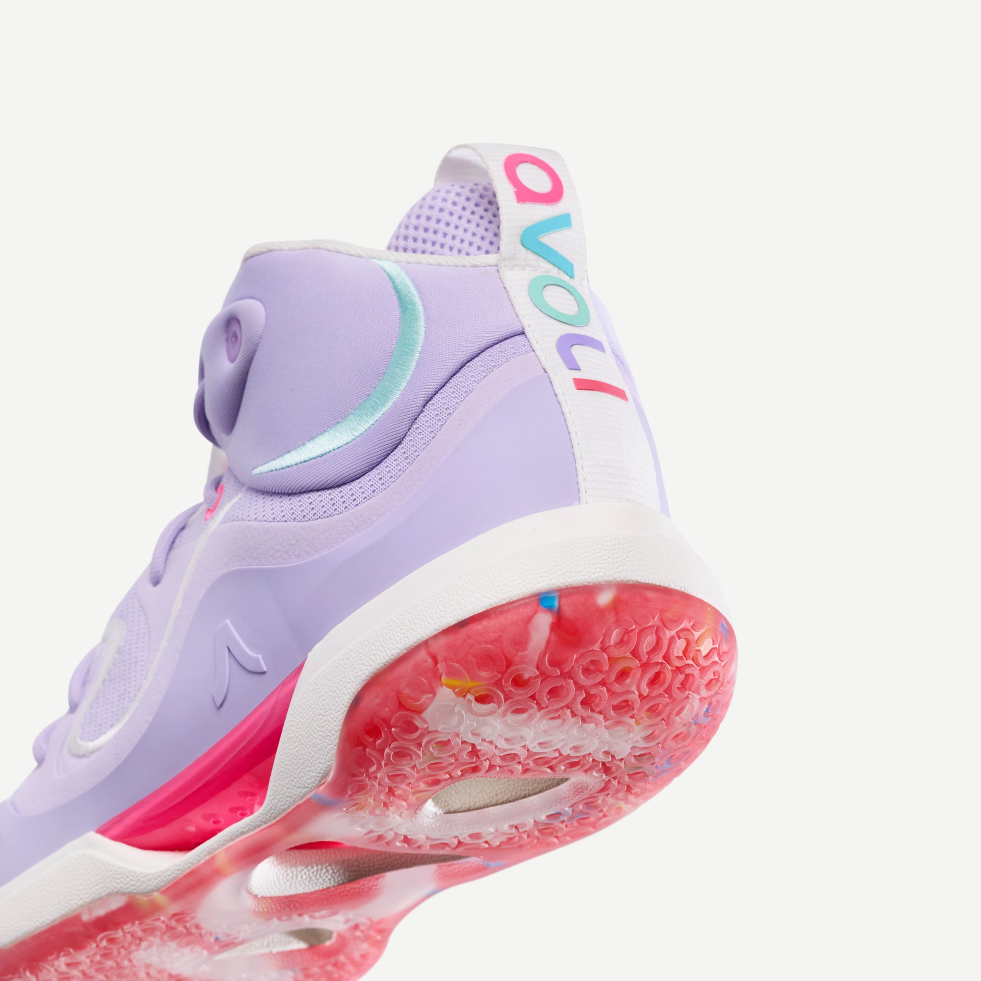 Purple and pink volleyball mid-top sneaker on a white background
