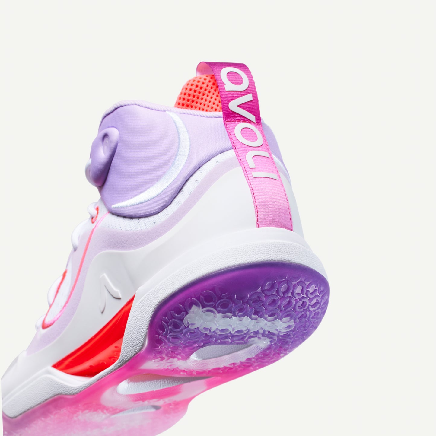 White, lavender, pink and purple mid-top volleyball sneaker with red accents on a white background