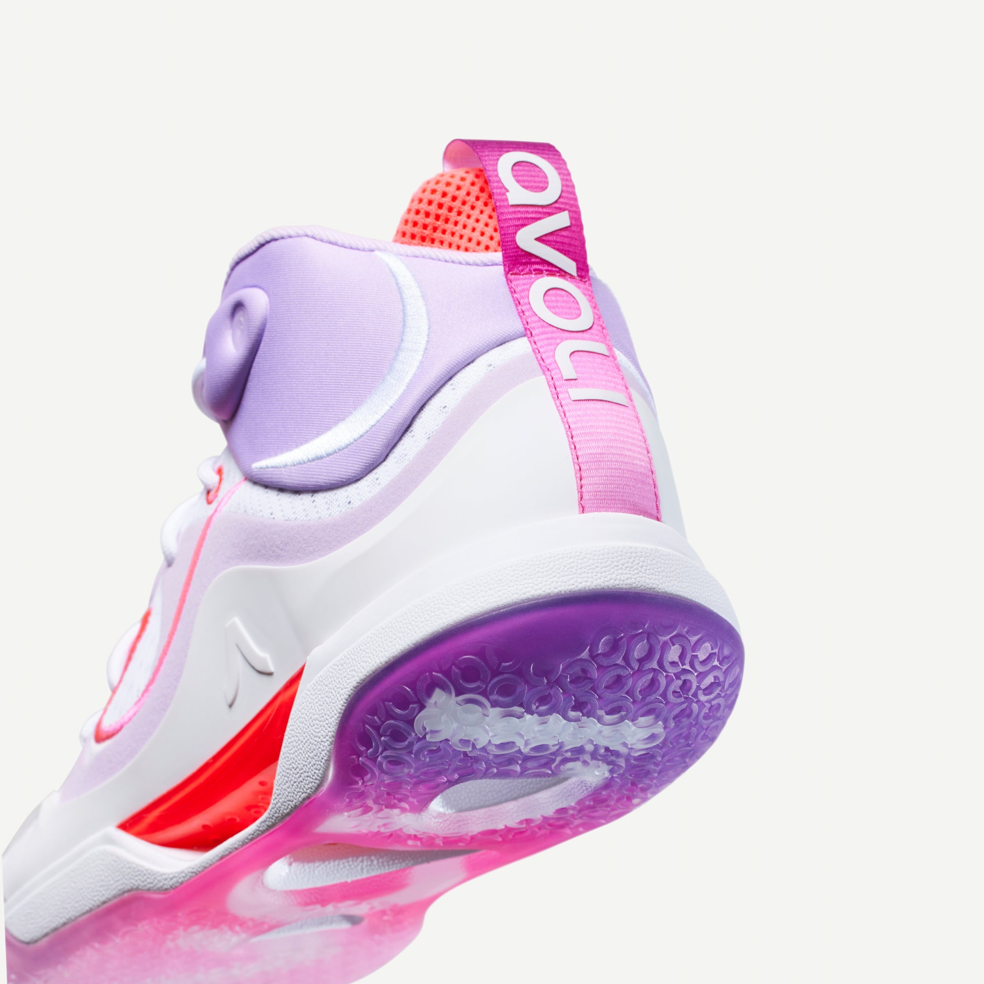 White, lavender, pink and purple mid-top volleyball sneaker with red accents on a white background