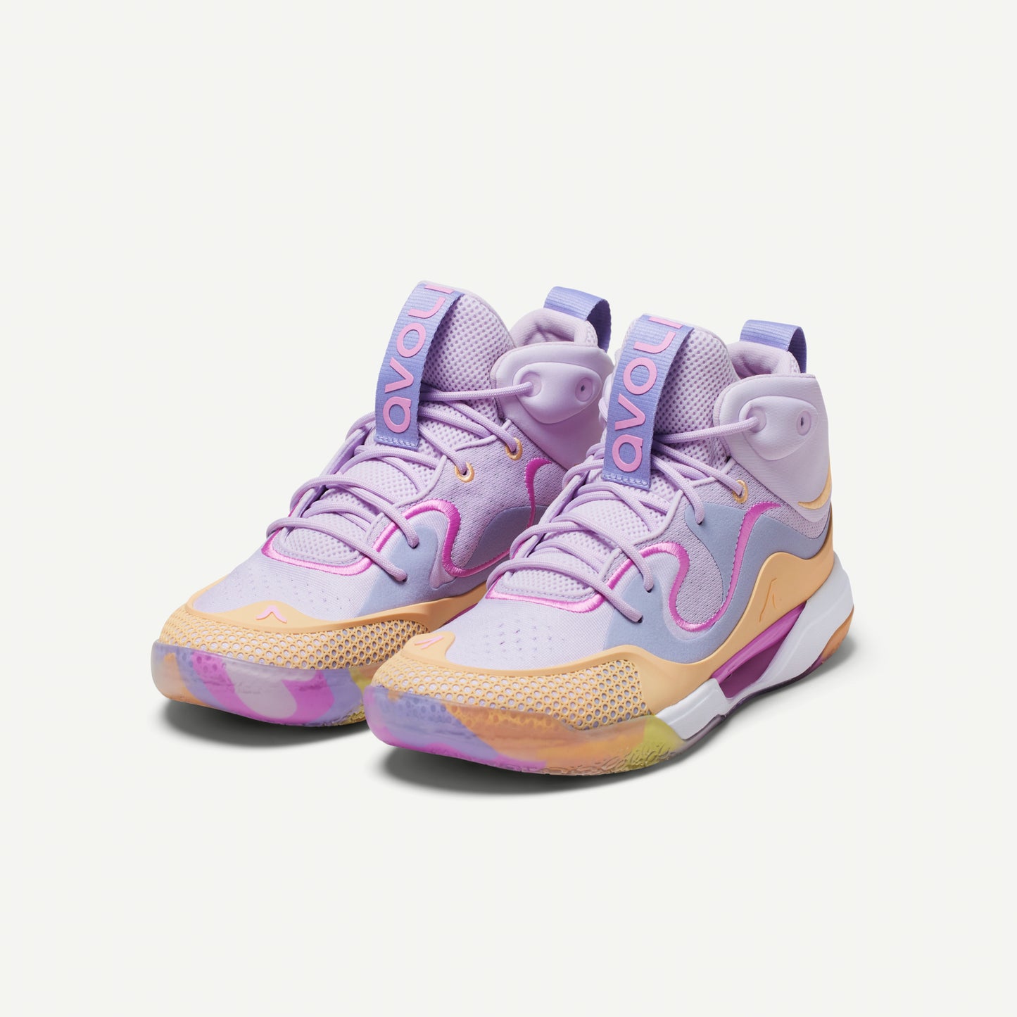 Pair of multicolored volleyball mid-top sneakers in  lavender with a pastel color scheme on a white background