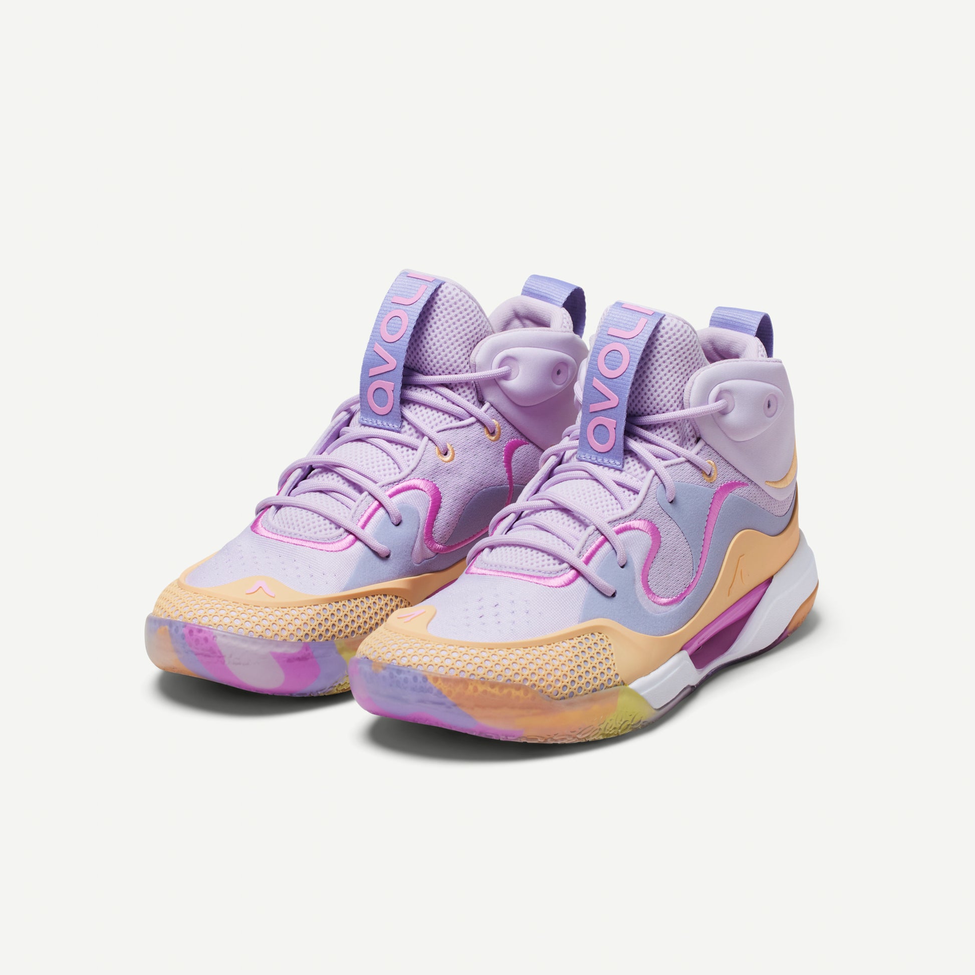 Pair of multicolored volleyball mid-top sneakers in  lavender with a pastel color scheme on a white background