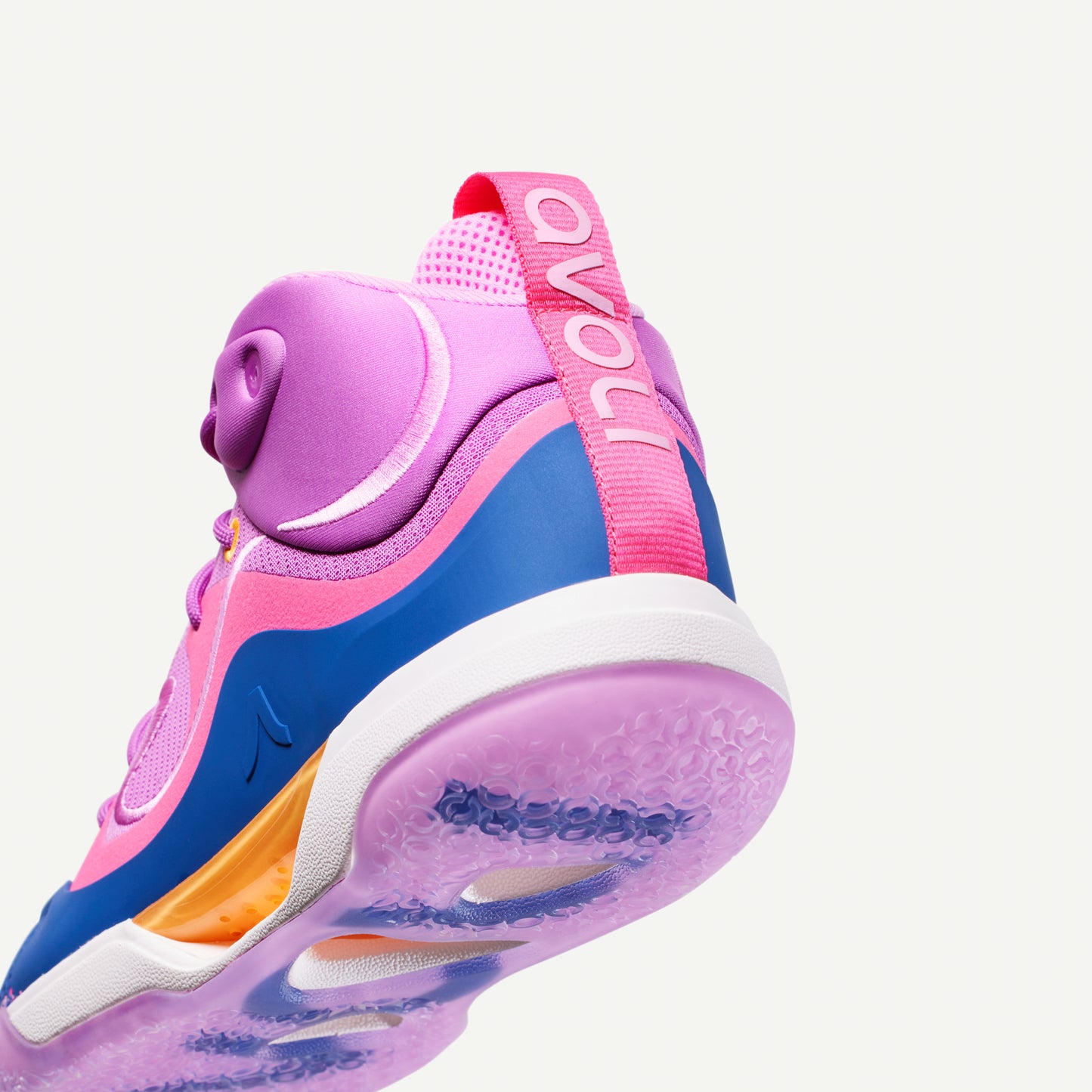 Colorful mid-top volleyball shoe with purple and pink design, with blue and orange accents on a white background