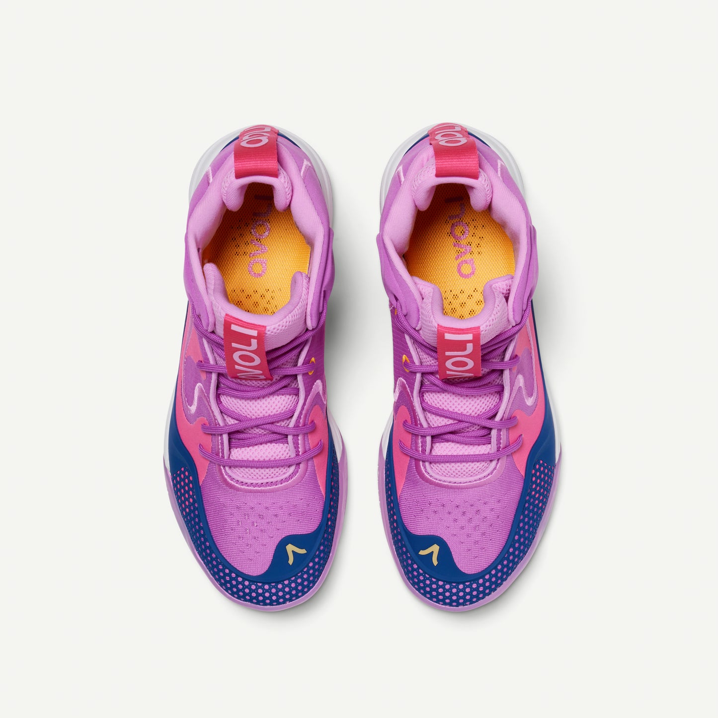Colorful mid-top volleyball shoes with purple and pink design, with blue and orange accents on a white background