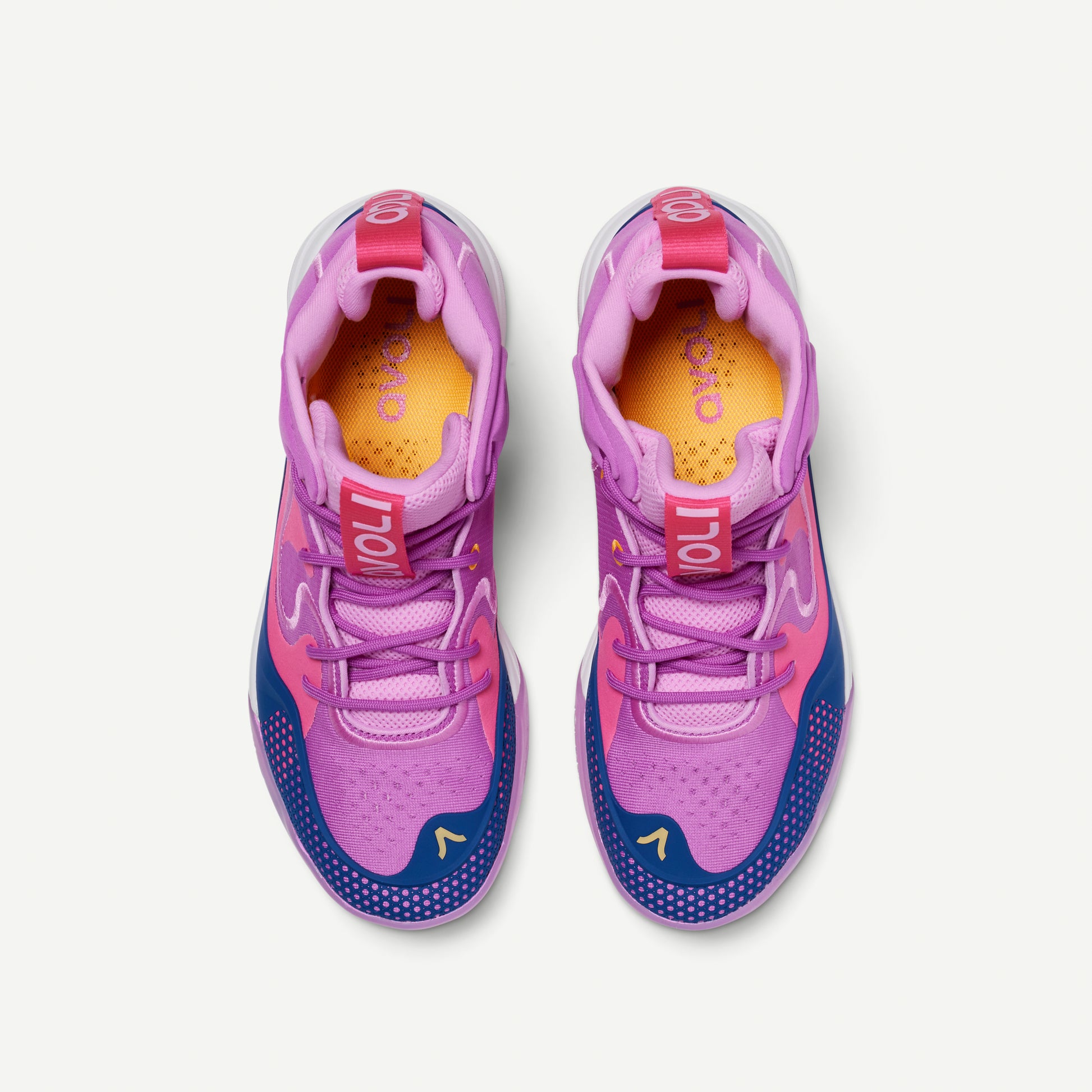 Colorful mid-top volleyball shoes with purple and pink design, with blue and orange accents on a white background