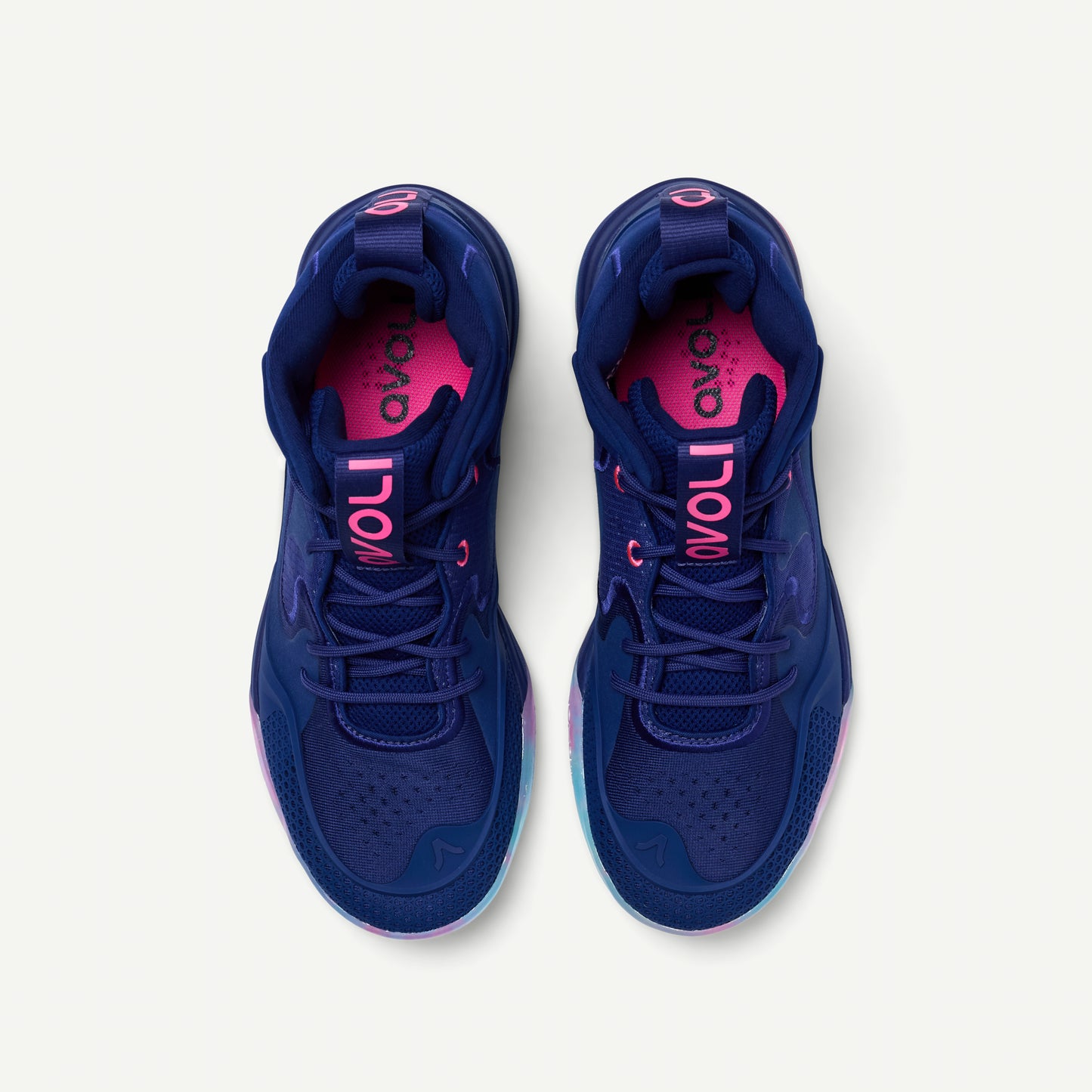 Blue volleyball mid top sneaker with a colorful sole on a white background