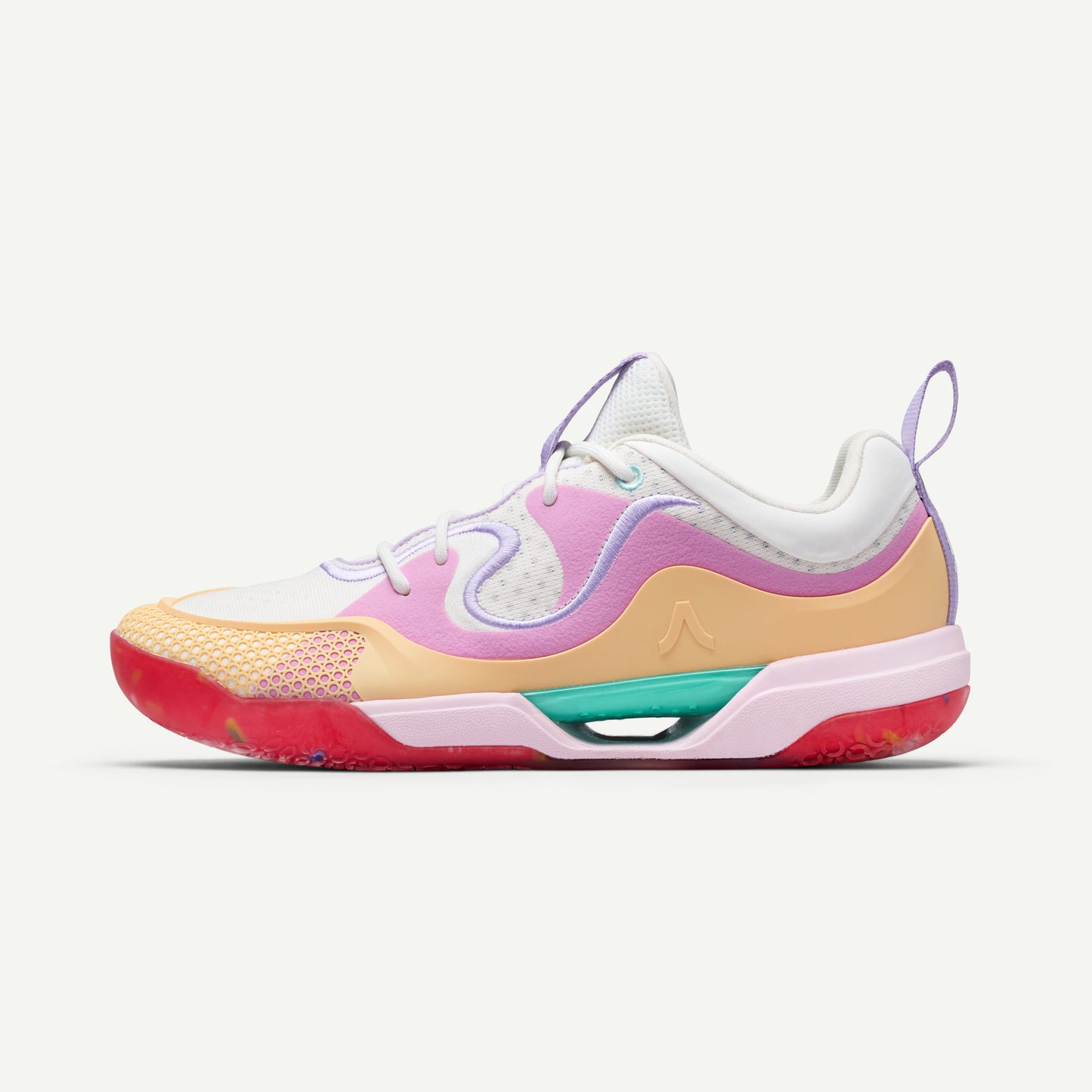 Colorful low top volleyball sneaker with a white, pink, yellow, and red design on a white background