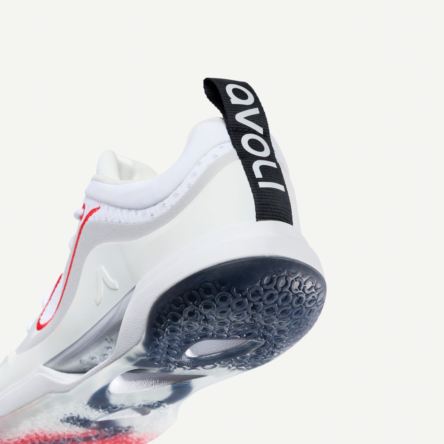 White volleyball sneaker heel with red accents on a white background and avoli brand logo